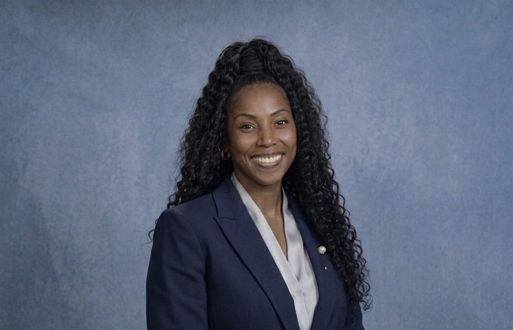 A professional headshot of Victoria Davis.